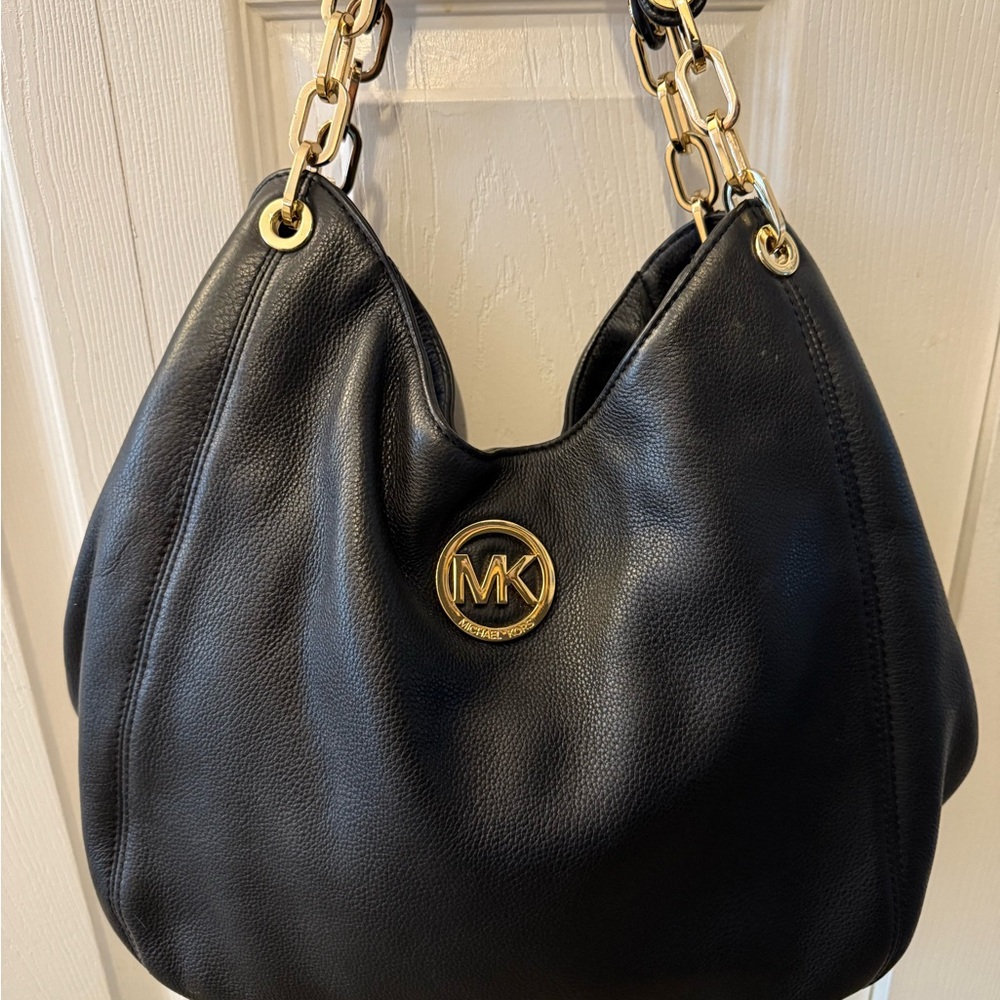 Michael Kors Black Hobo Bag with Gold Accents